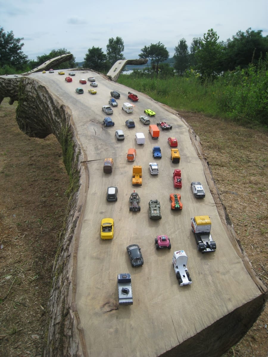 "ÜKS MAAILM" 2014 puu, plastikust putukad ja mänguautod p= 8 m - Geumgang Nature Art Biennale, Gongju, Lõuna Korea<br /> "ONE WORLD" 2014 wood, plastic insects and cars  l= 8 m - Geumgang Nature Art Biennale, Gongju, South Korea